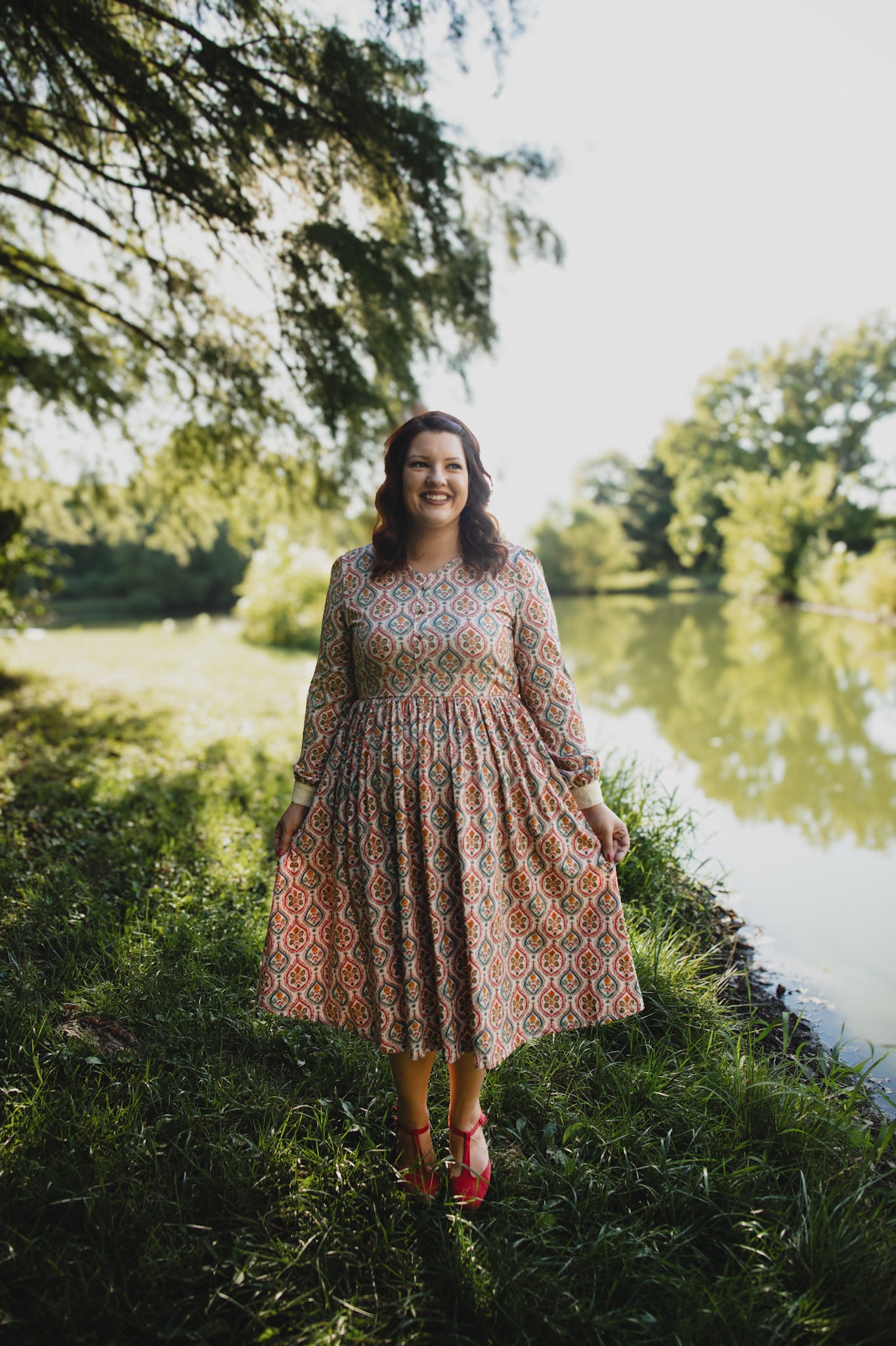 Woman wearing a patterned modest nursing dress