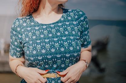 Woman in modest nursing dress with blue floral pattern